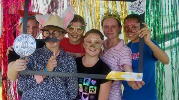 Students at Moree Christian School dress up and enjoy the activities at a carnival to celebrate the institution's 40th anniversary.