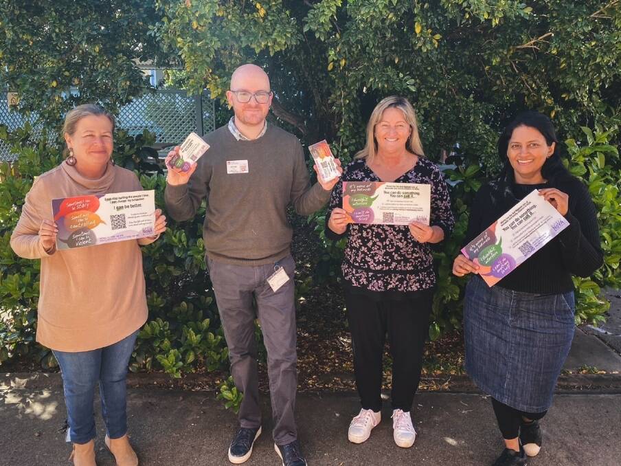 Members of the Moree No Violence Alliance (from left) Denise Haines, Ritchie Hair, Kerry Seaton and Magitha Suresh with stickers created to increase awareness of violence.