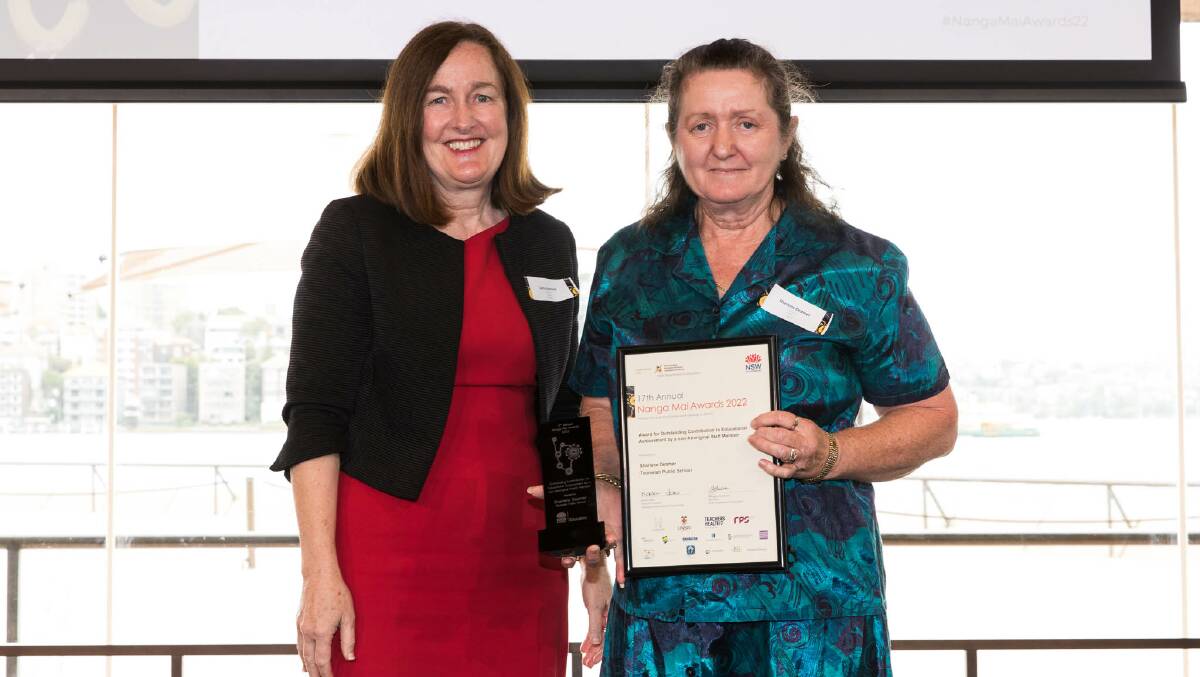 Executive Director of School Performance for Metropolitan North, Cathy Brennan, presents Sharlene Deamer with her Nanga Mai award. Picture supplied