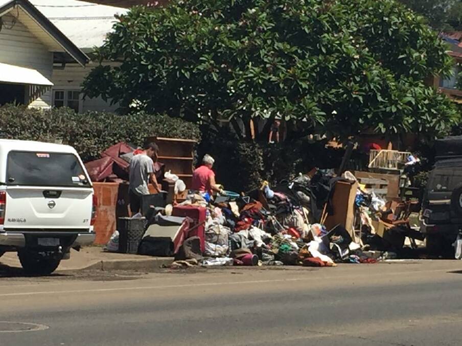 Residents of Wyrallah Rd, East Lismore begin the clean-up of their homes. Photo: Cathy Adams